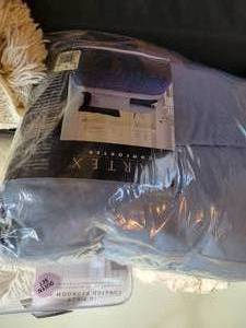 lot 52 image: A table full of Bedding and Linens. Various sizes. New and vintage.