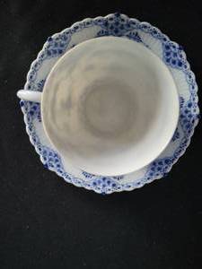 lot 77 image: Royal Copenhagen Full Lace Coffee Cup and Saucer #1035. Excellent condition.