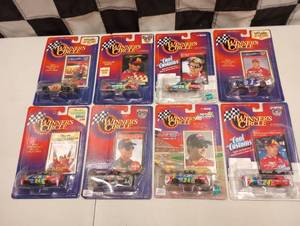 lot 103 image: Action Winners Circle Collectors Card & 164th Scale Die Cast Cars