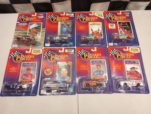 lot 105 image: Action Winners Circle Collectors Card & 164th Scale Die Cast Cars