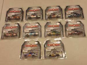 lot 233 image: Team Caliber Pit Stop 164th Scale Die Cast Cars