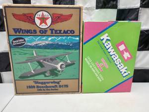 lot 328 image: Ertl Collectible $ Kawasaki Airplane Die Cast Coin Banks