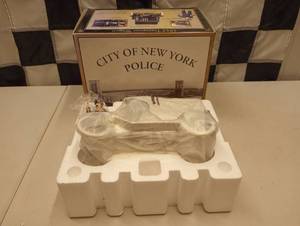 lot 991 image: Gearbox Collectibles NYPD 1912 Ford Model T Delivery Truck 116th Scale Die Cast