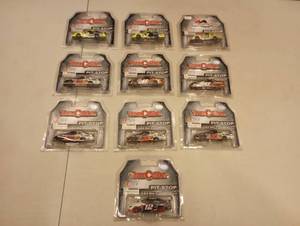 lot 945 image: Team Caliber Pit Stop 164th Scale Die Cast Cars