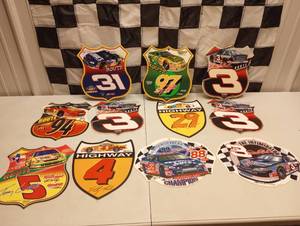 lot 1065A image: (11) Assorted Nascar Vinal Signs