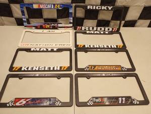 lot 1082 image: (8) Plastic Nascar license Plate Topper