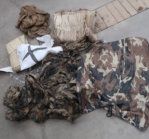 lot 12 image: DUCK BLIND ITEMS STRAW AND MESH FABRIC