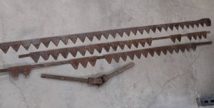 lot 56 image: VINTAGE FARM SICKLES AND DRIVE SHAFT