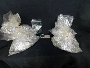 lot 87 image: Lot of 100 CSI - Crime Scene Investigation Key Chains with Magnifying Glass