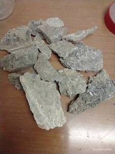 lot 43 image: Container Of Rocks - Many Pieces With Crystal Sides