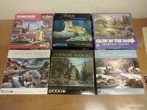 lot 48 image: (6) 1,000 Piece Puzzles - One Glows In The Dark