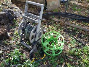 lot 130 image: (4) New Hang-Alls & (2) Hose StorageReels