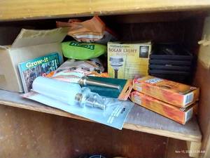 lot 428 image: Shelf Full Of Gardening Planters, Strike-A-Fire, Moss, Seeds, Etc.