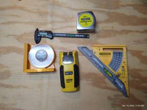 lot 513 image: Tape Measure, Square, Stud Finder, Digital Caliper, And Protractor Angle Locator