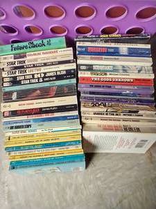lot 553 image: (2) Stacks Misc. Paperbacks - Comic Characters & Science Fiction