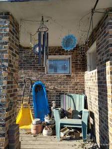 lot 866 image: Contents of Porch - Lawn Chairs, Wind Chimes, Etc