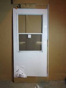 lot 77 image: Andersen Retractable Storm Door - 36.25 in x 80 in