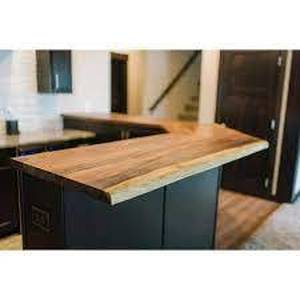 lot 56 image: Hardwood Reflections 6 ft. L x 25 in. D Unfinished Saman Solid Wood Butcher Block Countertop With Live Edge