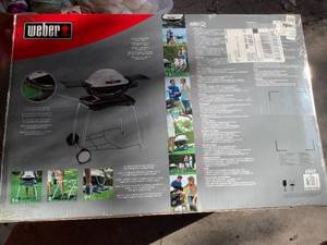 lot 677 image: Weber Rolling Cart