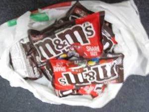 lot 63 image: 12- 3.14 oz M&Ms...
