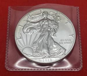 lot 78 image: 2020 Silver American Eagle 1 Troy Oz. .999 Fine Silver (In Protective Sleeve)