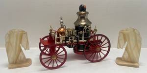 lot 197 image: Vintage 1867 Mississippi Fire Truck No. 313 Jim Beam Decanter & Stone Horse Head Bookends