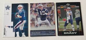 lot 217 image: Tom Brady 3 Card Lot - 2007 Leaf Rookies and Stars #58, 2007 Donruss Gridiron Gear #57, 2007 Topps Chrome #TC6 Football Cards