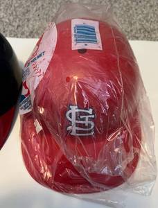 lot 325 image: Two Vintage Laich Souvenir Helmets - St. Louis Cardinals New in Package and Cleveland Indians MLB Baseball