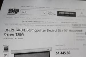 lot 20 image: New Da-Lite 34460L Cosmopolitan Electrol  Electric  Motorized 60x96 Video Projector Projection Screen - $1,000 Online