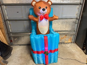 lot 17 image: 5 ft Inflatable Teddy Bear Gift Box - Bear Pops Up and Down