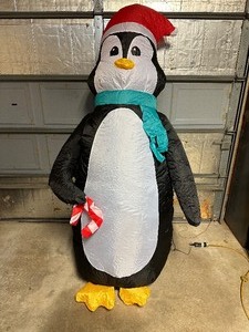 lot 62 image: 7 ft Air Blown Inflatable Light Up Penquin