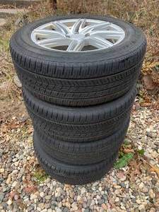 lot 56 image: Tires and Aluminum Rims Set of 4 Yokohama Tires with Rims