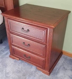 lot 12 image: 2 Oak three - drawer nightstands