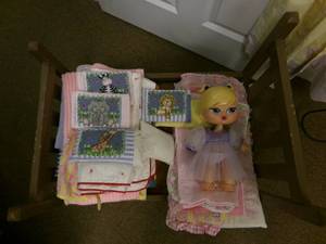 lot 26 image: vintage doll bed with bedding and d...