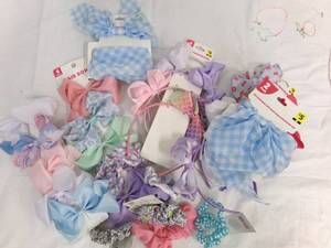lot 102 image: misc. lot of hair bows and hair tie...
