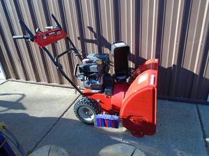 Yard Machine 24 179 cc snow blower with electric start. Nice used condition. As shown. THIS ITEM HAS A RESERVE.