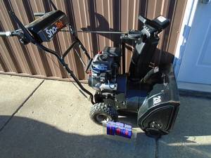 Snotek 22 snow blower with electric start. Used condition. Tested & works. As shown.