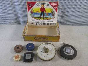 lot 80 image: (BSB) Vintage Tape Measures In Vintage Cigar Box