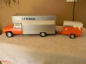 lot 52 image: VINTAGE RARE - NYLINT U HAUL MAXI MOVER TRUCK - Pressed Steel Roll Up Door w Ramp WITH NYLINT U HAUL TRAILER - NICE - FANTASTIC PECES - SEE PICTURES