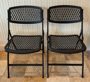 Two Black Plastic Chairs
