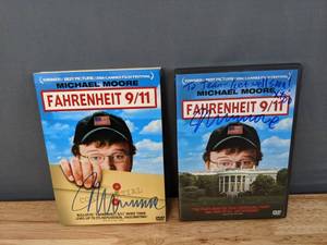 lot 51 image: Autographed Michael Moore Fahrenheit 911 DVD Jacket and Personalized M