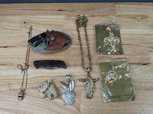 lot 45 image: Assorted Hip Hop Pendants Jewelry, Necklaces, Pocket Knife, Belt Buckle, and More K
