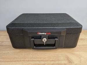 lot 76 image: Black SentrySafe Fire Resistant Lock Box with Key R