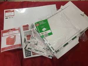 lot 107 image: Stack of various sized holiday gift boxes