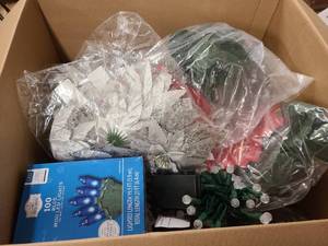 lot 111 image: Box of misc christmas decor. Lights and other goods ready for use