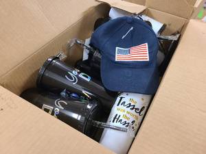 lot 145 image: Box of Graduation themed gifts and items