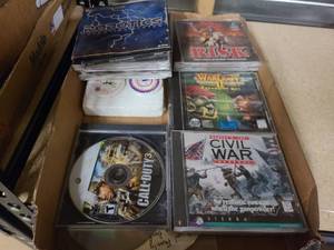 lot 16 image: LL Assortment of CDs, PC Games and more.