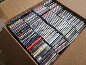lot 32 image: Huge box of CDs, some used, some still in new wrapping.