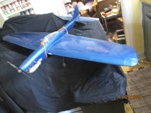 lot 35 image: 1965 Nationals Winner Jim Van Loos semi-scale Chipmunk Control Line Stunter Gas motor model airplane with a 55 wing span. Comes with original box, paperwork and accessories