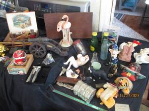 lot 45 image: Large collection of Vintage trinkets and decor including wooden smoking pipes, cast iron toy tow truck, cannon model and more